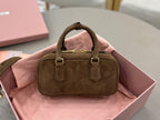 Suede mini handbag with top handles and gold hardware, front flap details