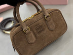 Suede mini handbag with top handle and crossbody strap, gold hardware and logo