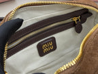 Suede mini handbag interior lining with dark trim and miumiu logo patch