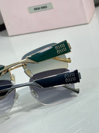 Two pairs of gold-tone sunglasses with green and navy logo temple details