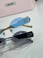 MiuMiu sunglasses with gold metal frame and blue tinted lenses