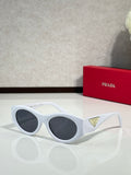 Prada white cat-eye sunglasses with dark lenses and curved temples