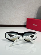 Prada white patterned sunglasses with dark lenses and straight temple detail