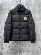 Long puffer jacket, dark color, front zip and small chest logo patch