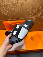 Hermes slide sandal held, black leather with white strap and black detail blocks