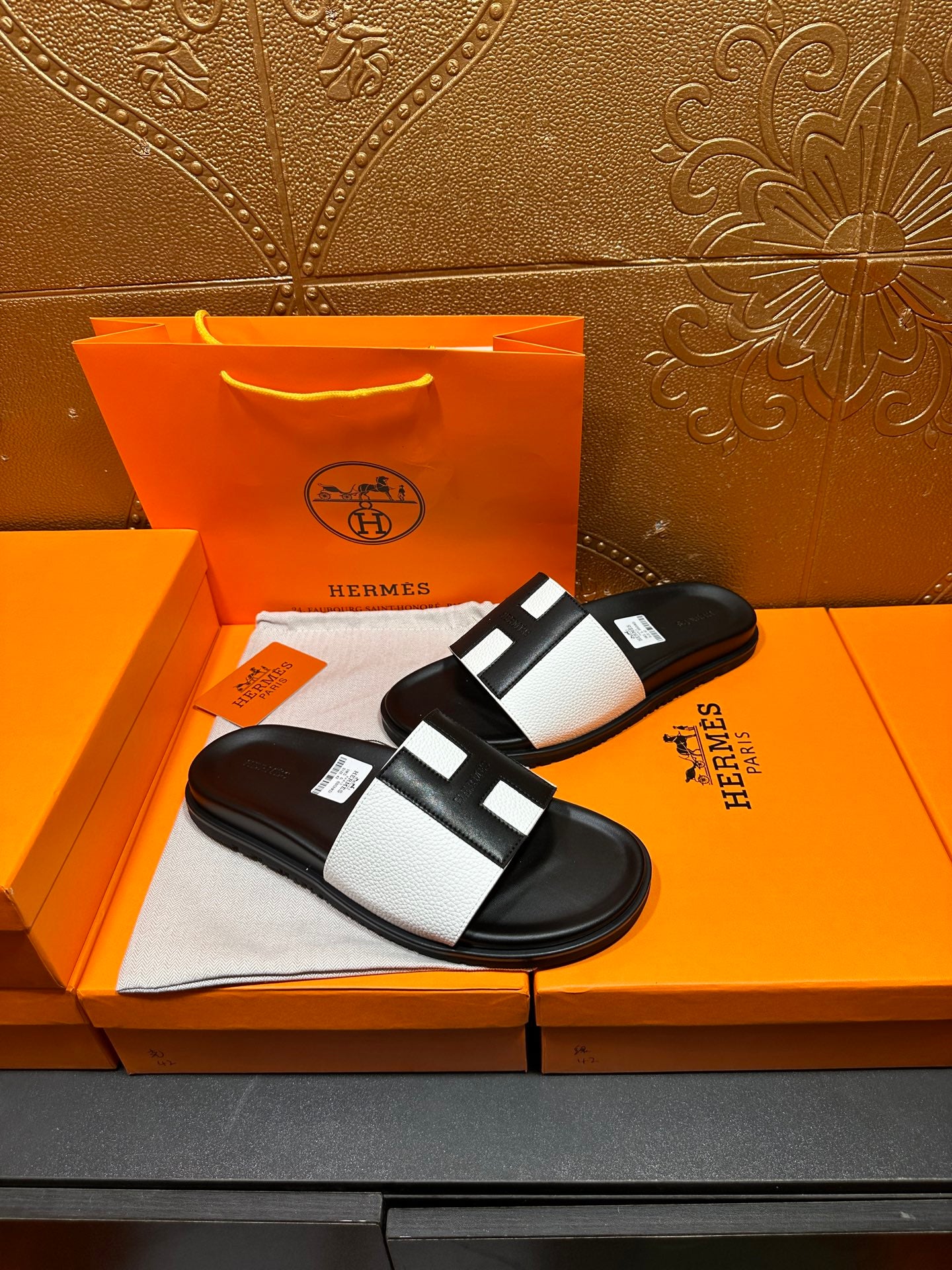 Hermes sandals with black sole and white strap bands, open-toe slip-on