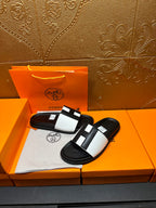 Hermes slide sandals pair, black base with white strap and black center blocks