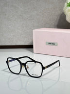 Black full-rim eyeglasses with clear lenses and MiuMiu logo at the front