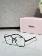 Black full-rim eyeglasses with clear lenses and MiuMiu logo, angled front view
