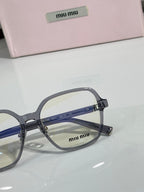 Gray full-rim eyeglasses with blue lens tint and MiuMiu logo on the front