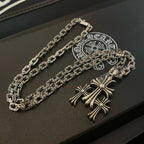 Silver cross pendant necklace set with two chains on dark gift box