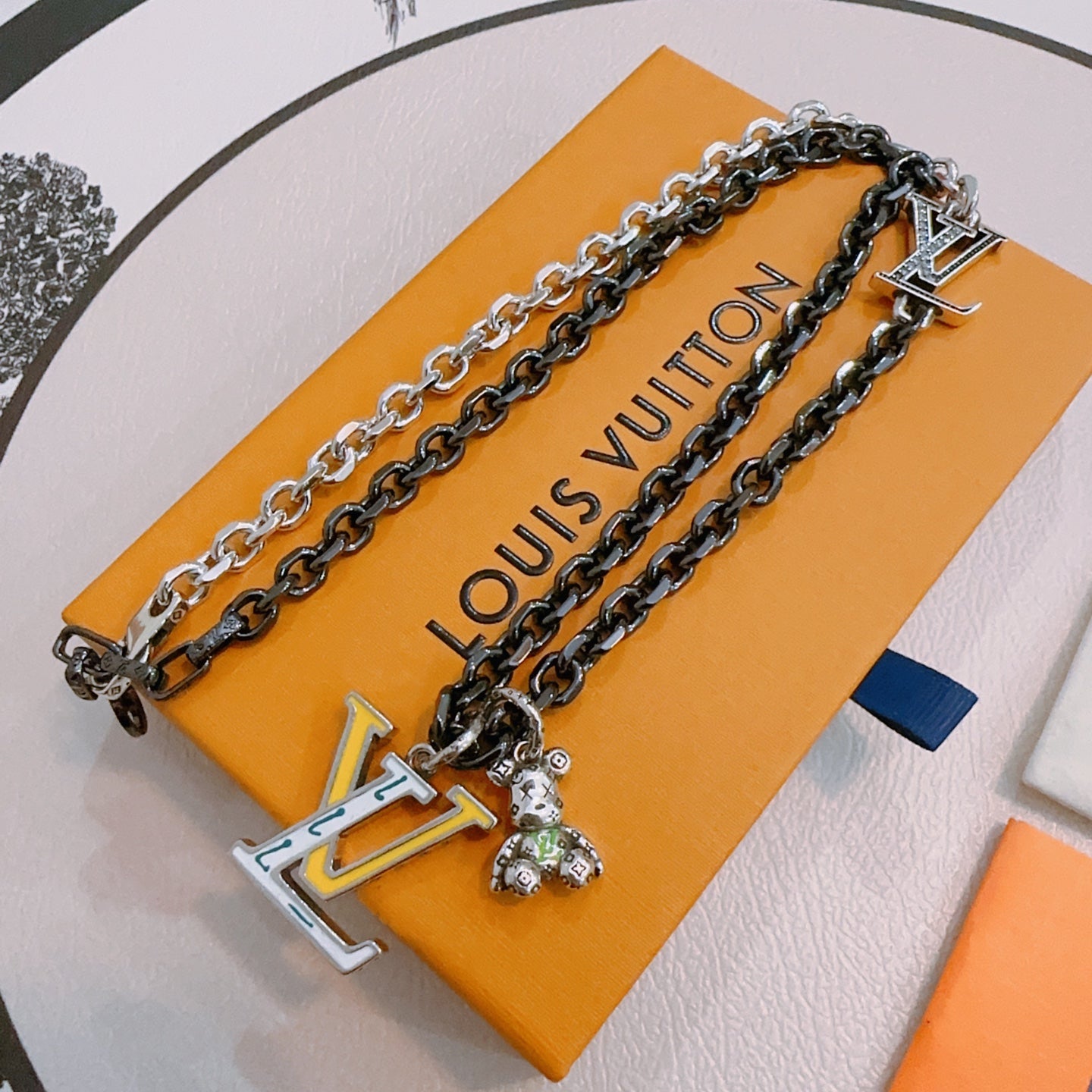 Louis Vuitton necklace, silver-tone chain with large LV charm pendant