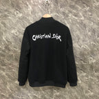 Dior long jacket back view with white Christian Dior logo on dark fabric