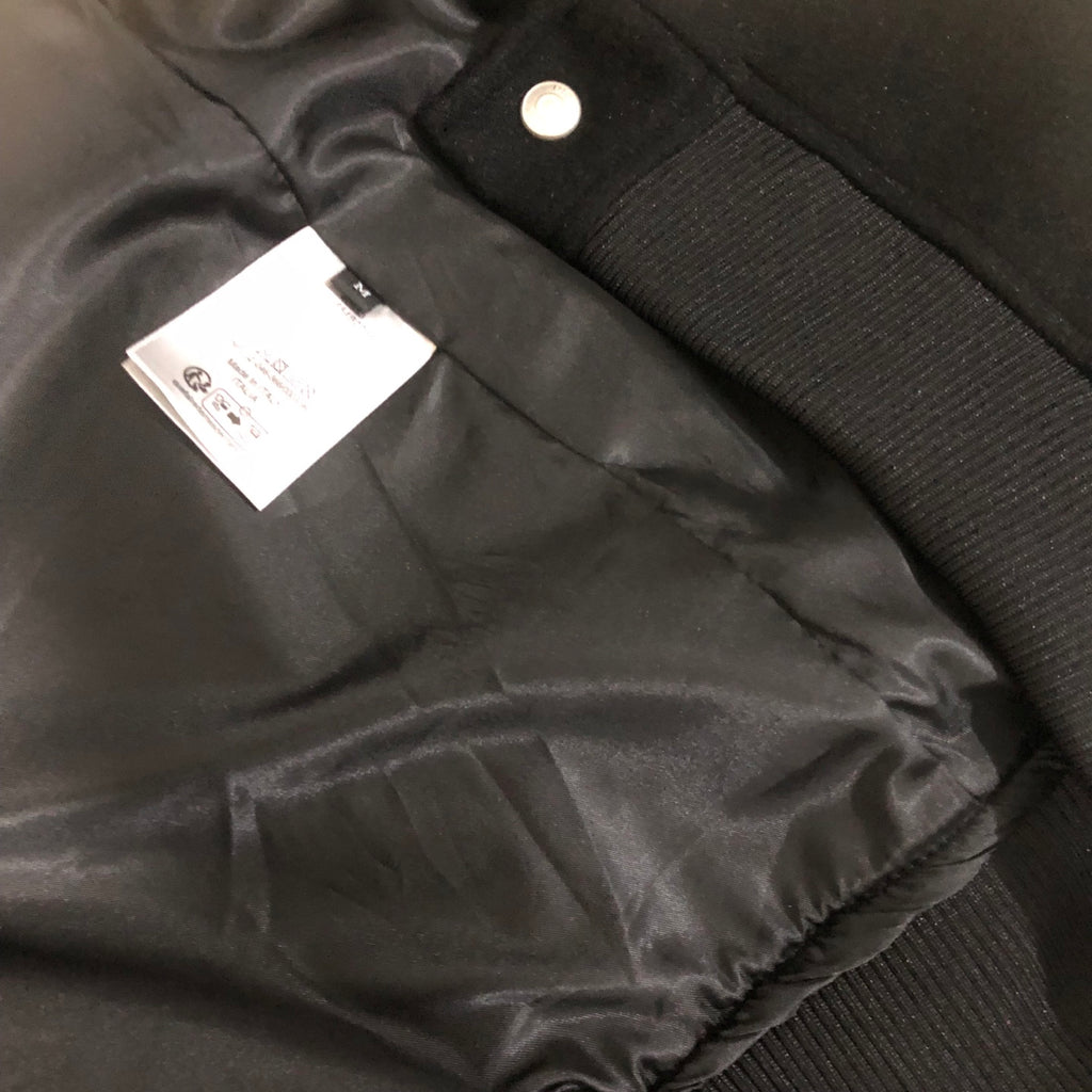 Dior long jacket interior with satin lining, snap button, and fabric label tag