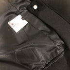 Dior long jacket interior with satin lining, snap button, and fabric label tag