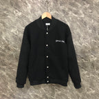 Dior long jacket in dark fabric with front snap buttons and ribbed cuffs and hem