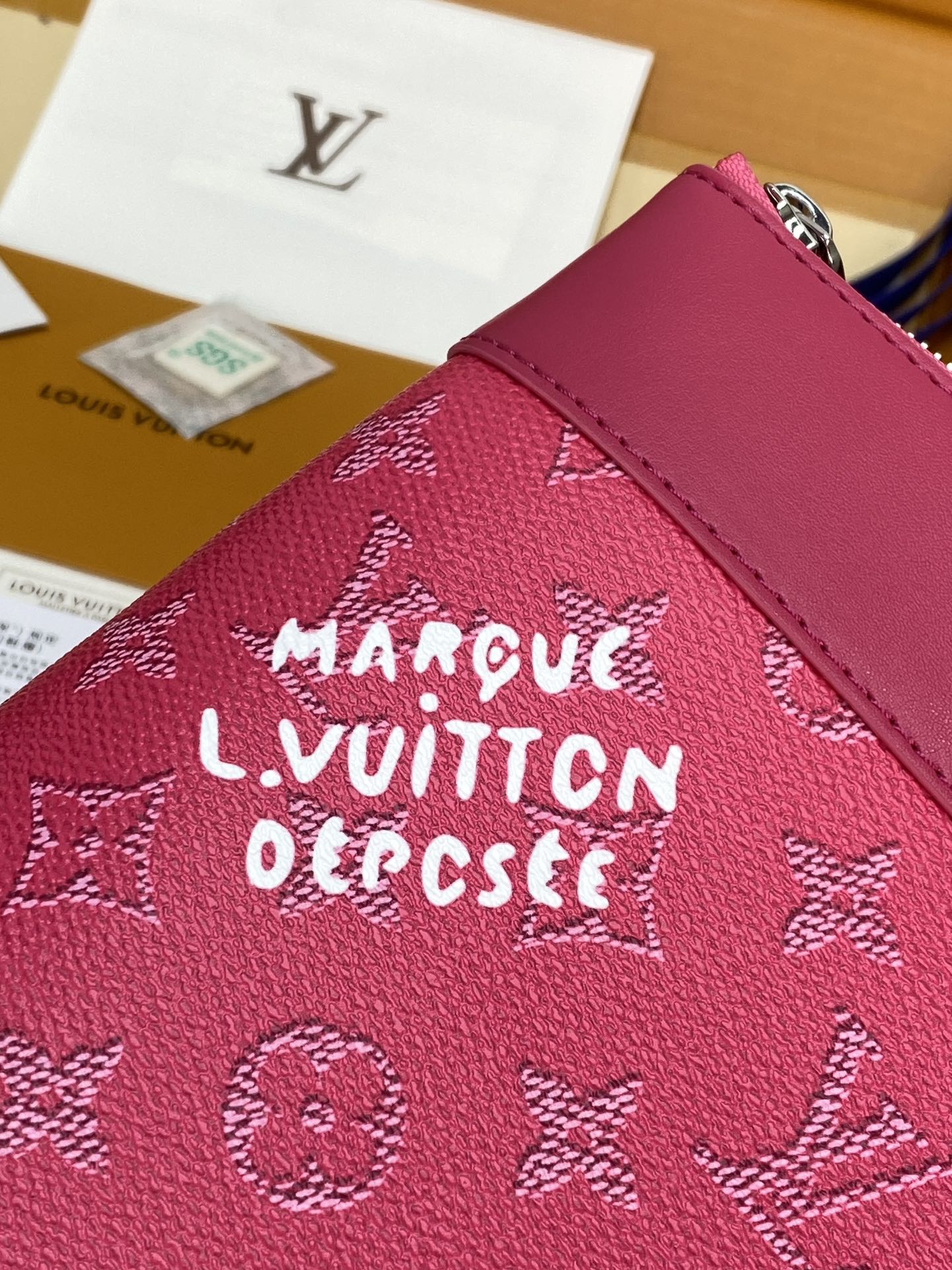 Louis Vuitton small pink bag with Monogram pattern and zipper pull