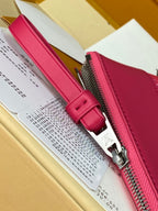 Fuchsia zippered pouch with leather pull tab and silver zipper hardware