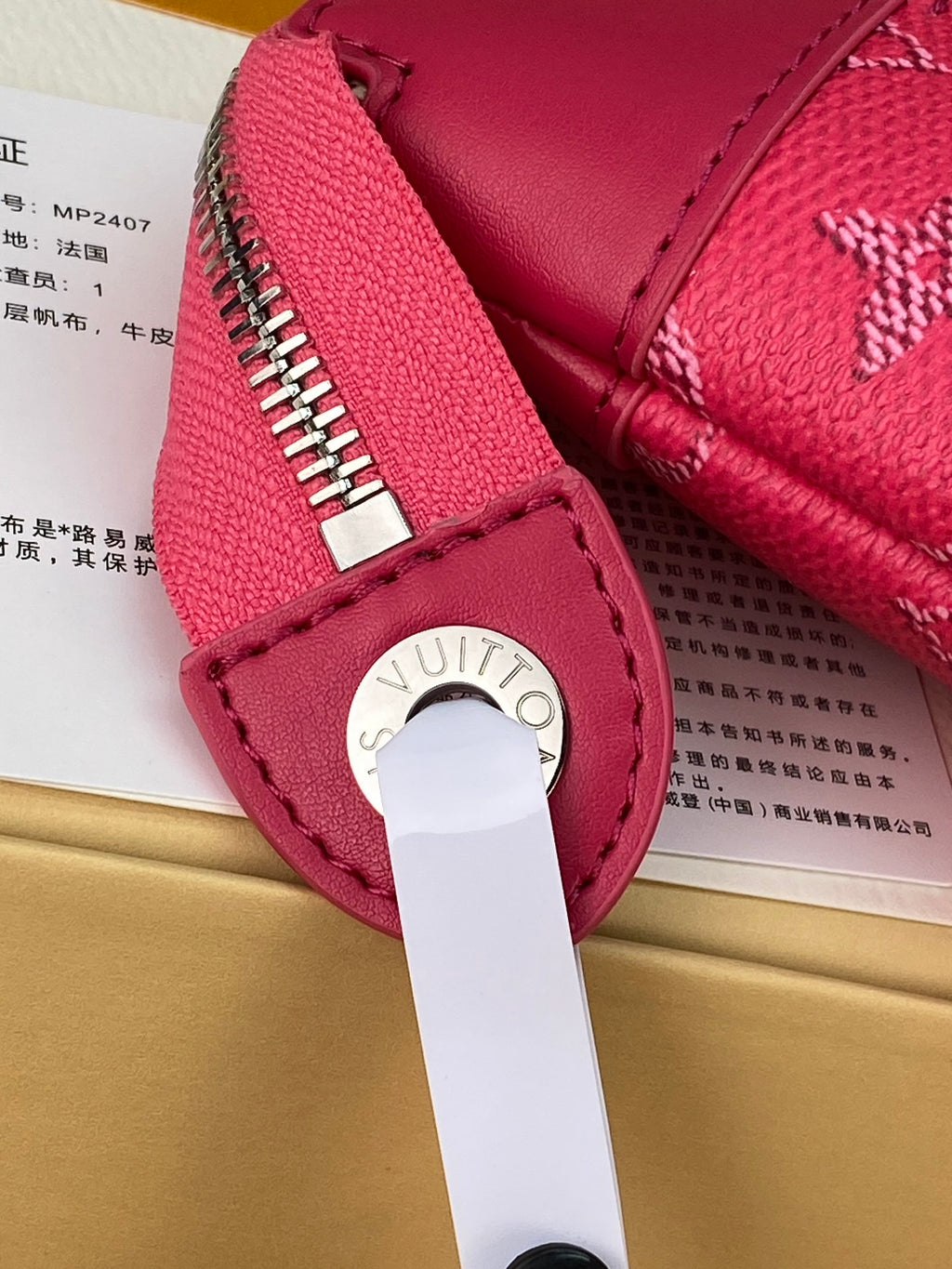 Louis Vuitton pink small bag with zipper and metal logo pull tab