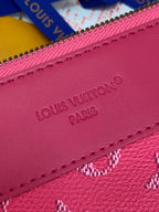 Louis Vuitton pink monogram clutch bag close-up of “Louis Vuitton Paris” embossing