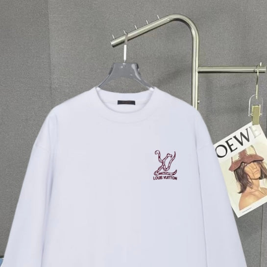 White long-sleeve sweatshirt with maroon logo print on the front
