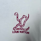Maroon Louis Vuitton logo graphic on white sweatshirt fabric