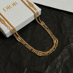 Gold-tone chain necklace close-up with lobster clasp