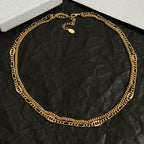 Gold-tone chain necklace with small round charm detail