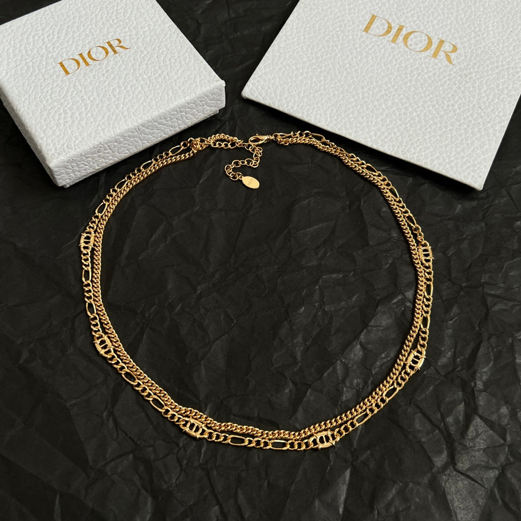 Gold-tone chain necklace with small round charm pendant
