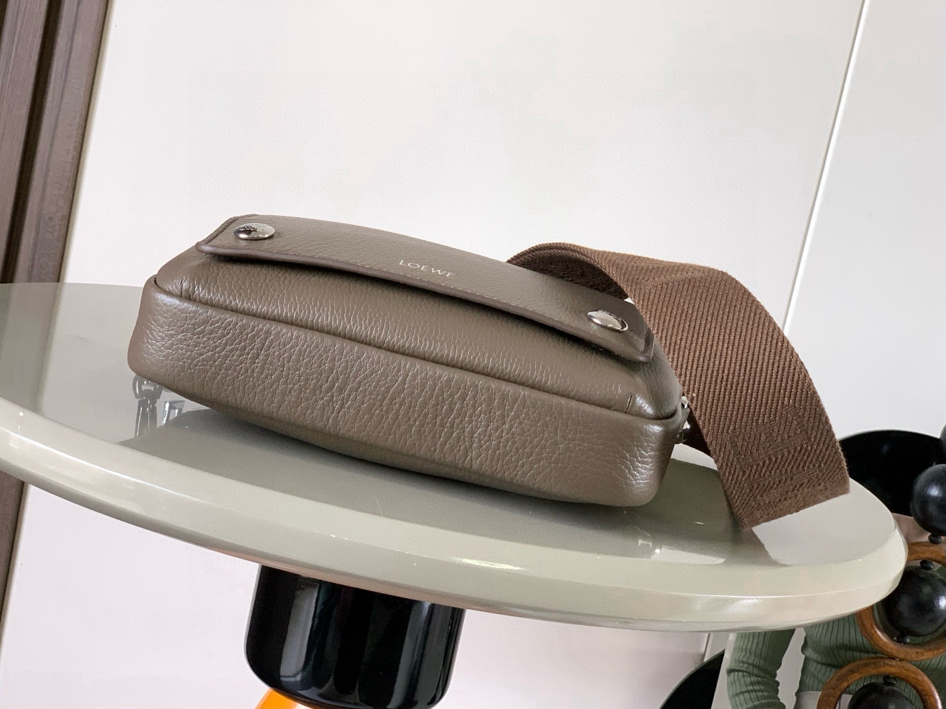 Loewe men's taupe leather crossbody bag, top flap and silver stud detail