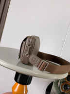 Loewe men's taupe leather crossbody bag, side view with adjustable strap