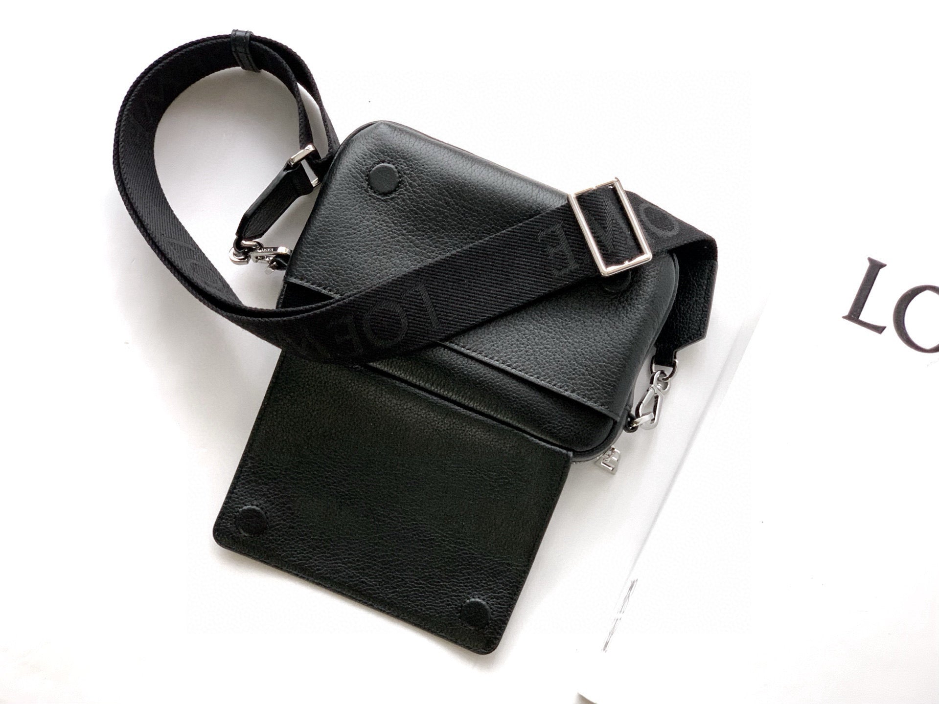 Men's crossbody bag with small pouch and long strap, black leather and silver buckles