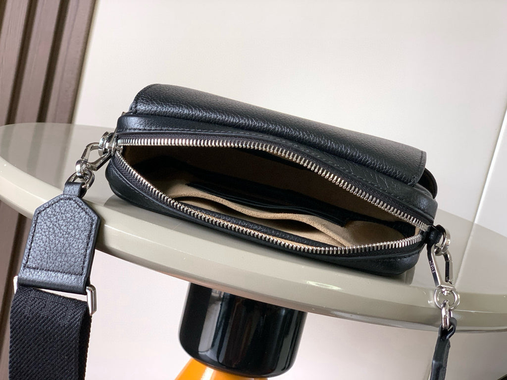 Dark leather crossbody bag with open top zipper showing black-lined interior