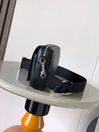 Dark leather crossbody bag side view with silver hardware and adjustable shoulder strap