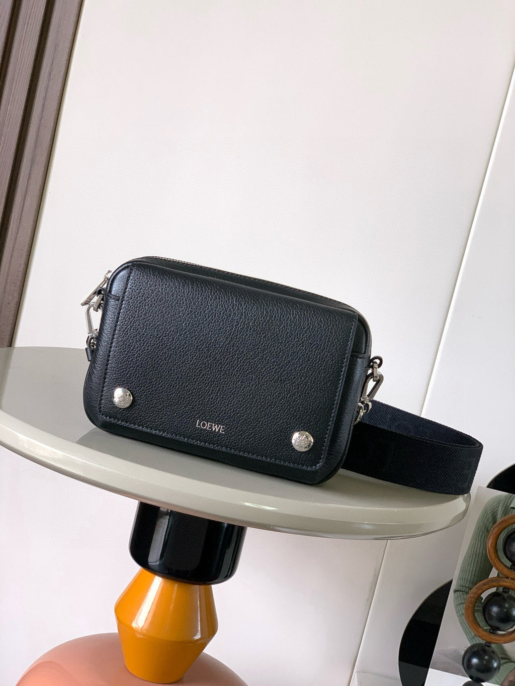 Men's crossbody bag in dark blue leather with front flap, silver-tone hardware, strap