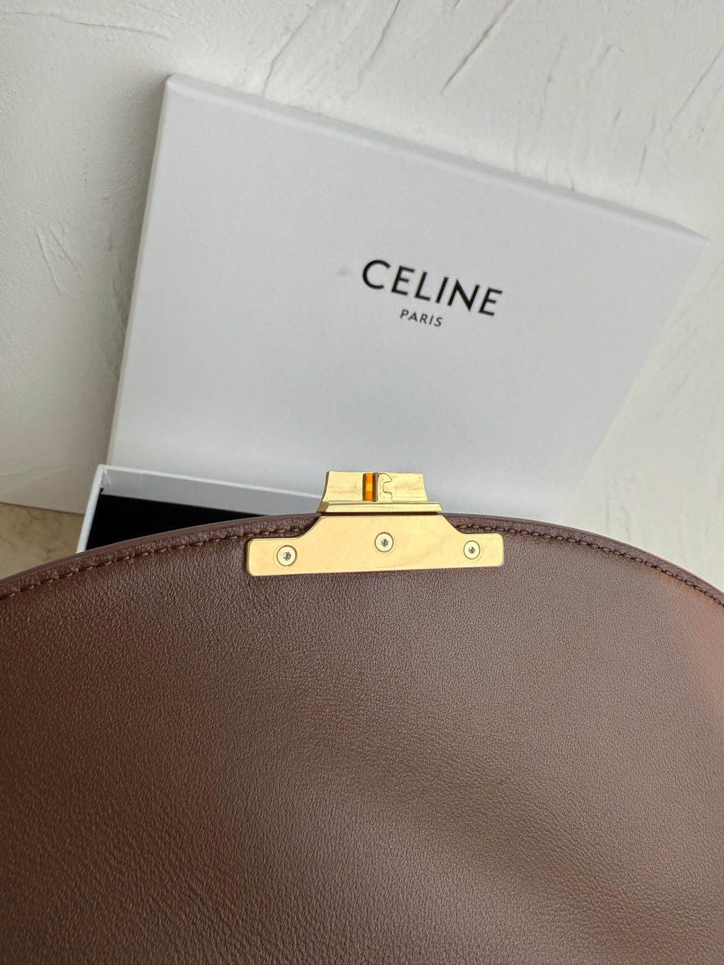 Celine brown leather bag handle mount with gold-tone bar and metal studs