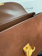 Celine brown leather bag with rolled top opening and gold-tone clasp hardware