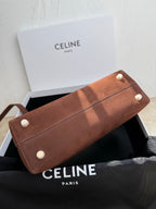 Celine brown leather long clutch bag with snap closure and white button accents
