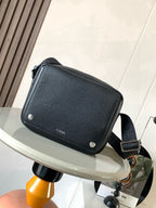 Loewe crossbody bag in dark pebbled leather with flap and snap buttons