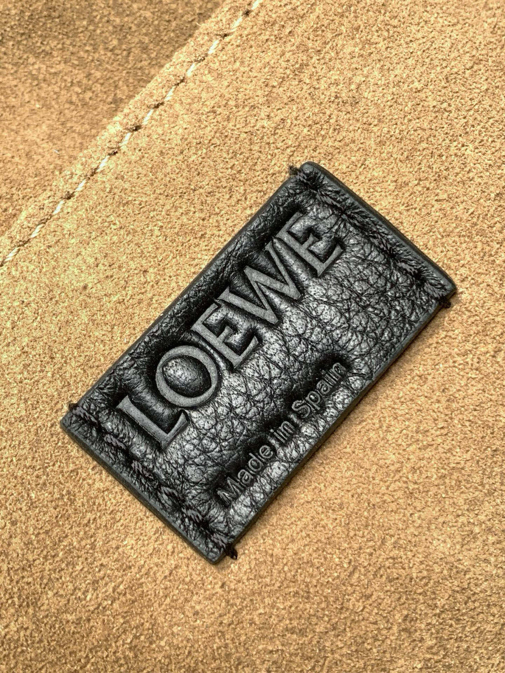 Leather size label reading LOEWE and Made in Spain