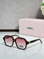 MiuMiu dark brown square eyeglasses with pink-tinted lenses and gold logo temples