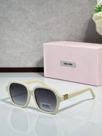 MiuMiu cream square eyeglasses with dark lenses and gold logo temples