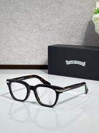 Black full-rim eyeglasses with brown-gold temple accents and rectangular lenses