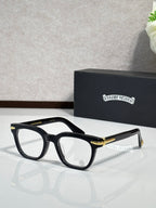 Black full-rim eyeglasses with gold-accent temples and rectangular lenses