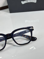Navy full-rim eyeglasses with logo detail on the temple and round-rectangular lenses