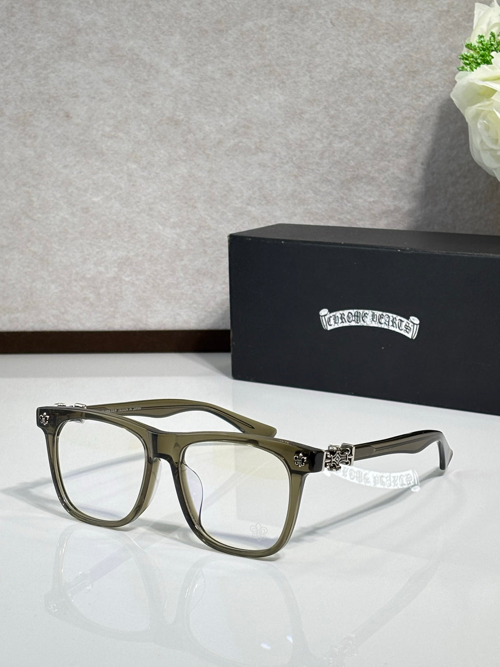 Chrome glasses with olive rectangular frames and clear lenses, decorative bridge and temples