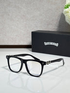 Chrome glasses with black rectangular frames and clear lenses, silver-tone bridge ornament