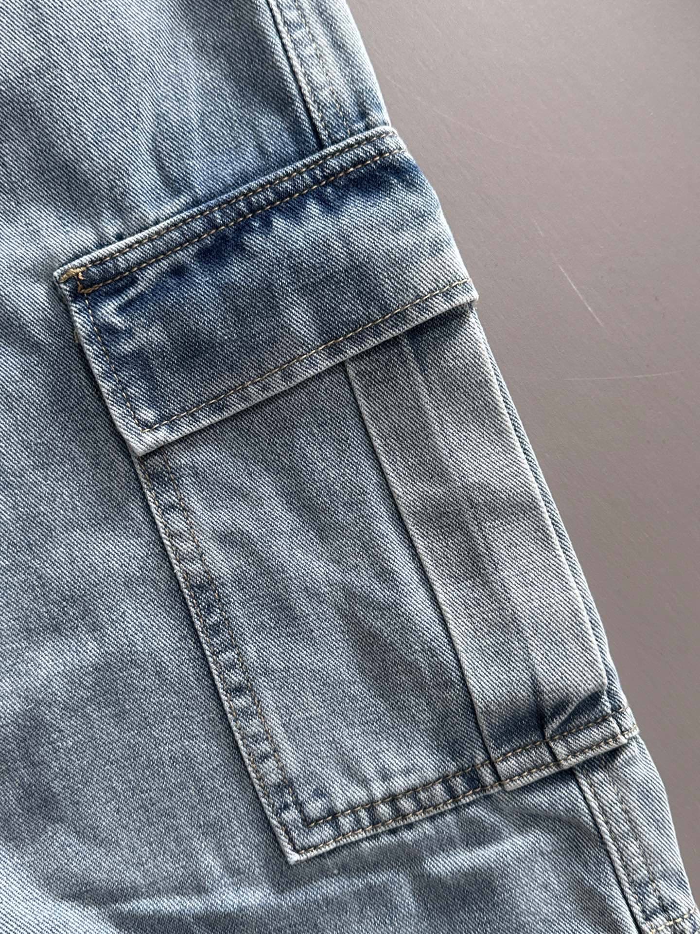 Louis Vuitton light blue denim cargo pants, stitched side flap pocket detail