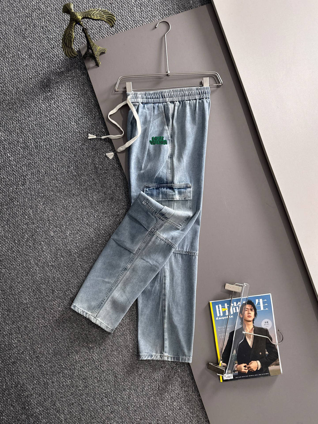 Louis Vuitton light blue denim cargo pants with elastic waist, drawstring, and front patch pockets