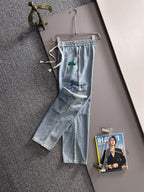Louis Vuitton light blue denim cargo pants with elastic waist, drawstring, and front patch pockets